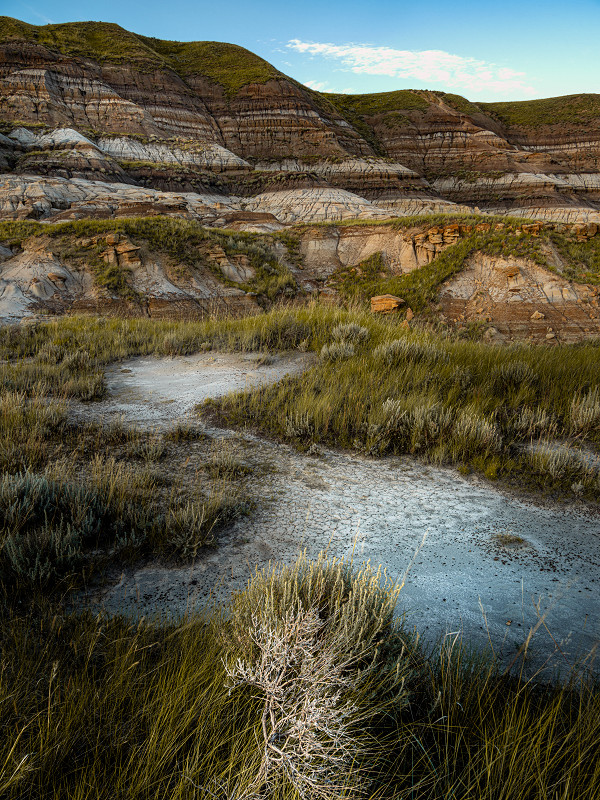 Dried mud leads you in to the cliffs of the valley near Drumheller, Alberta, Canada