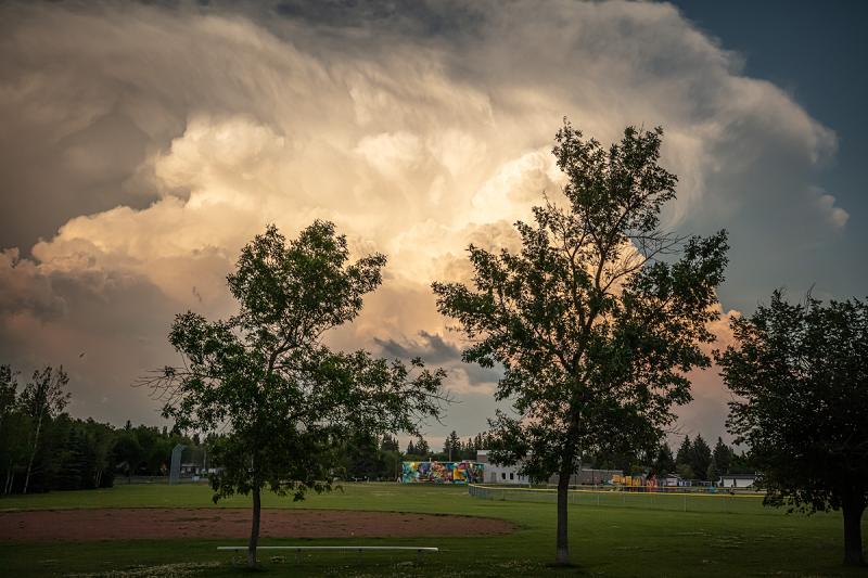 A shot of a hailstorm cloud at sunset